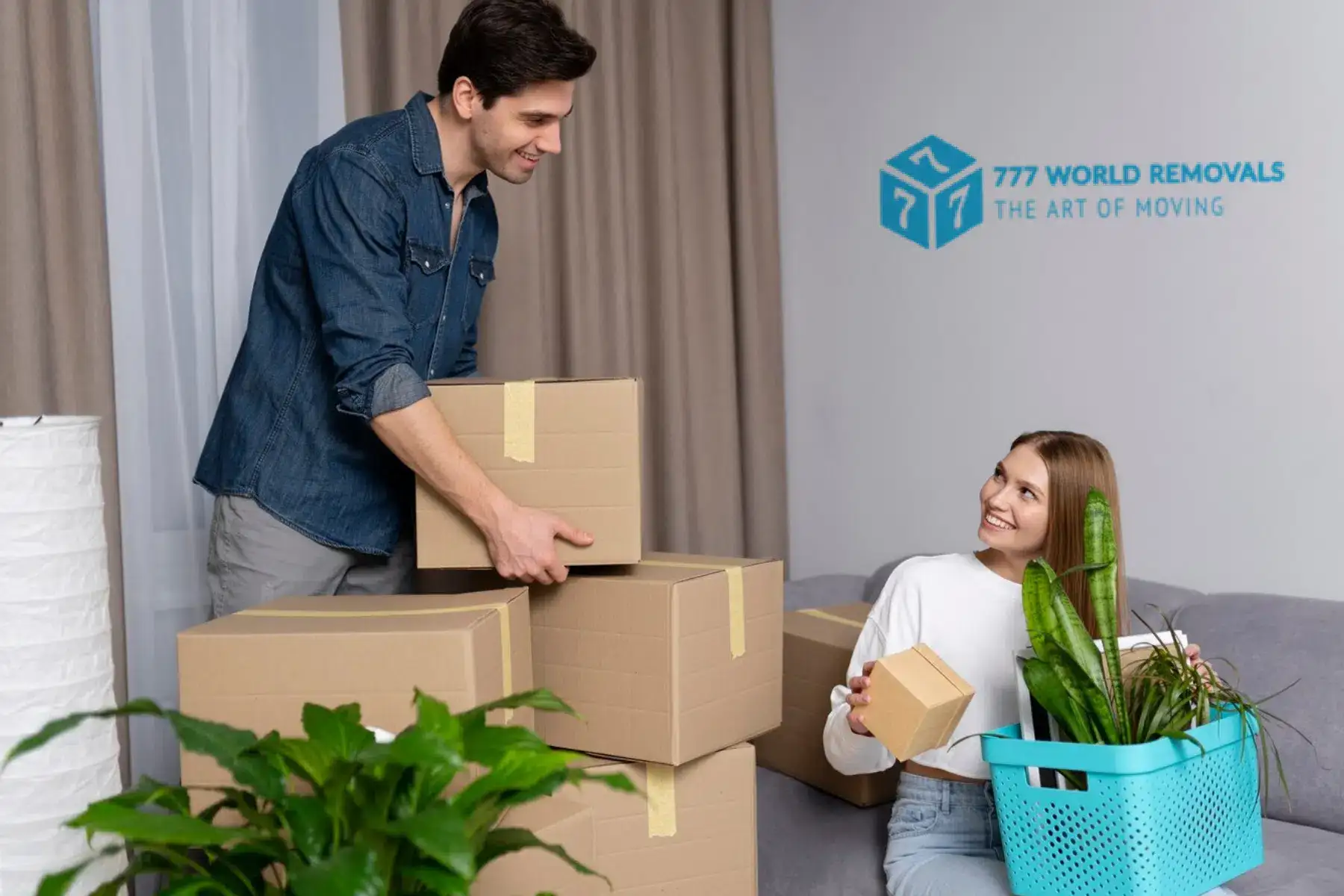 Couple packing moving boxes with 777 World Removals