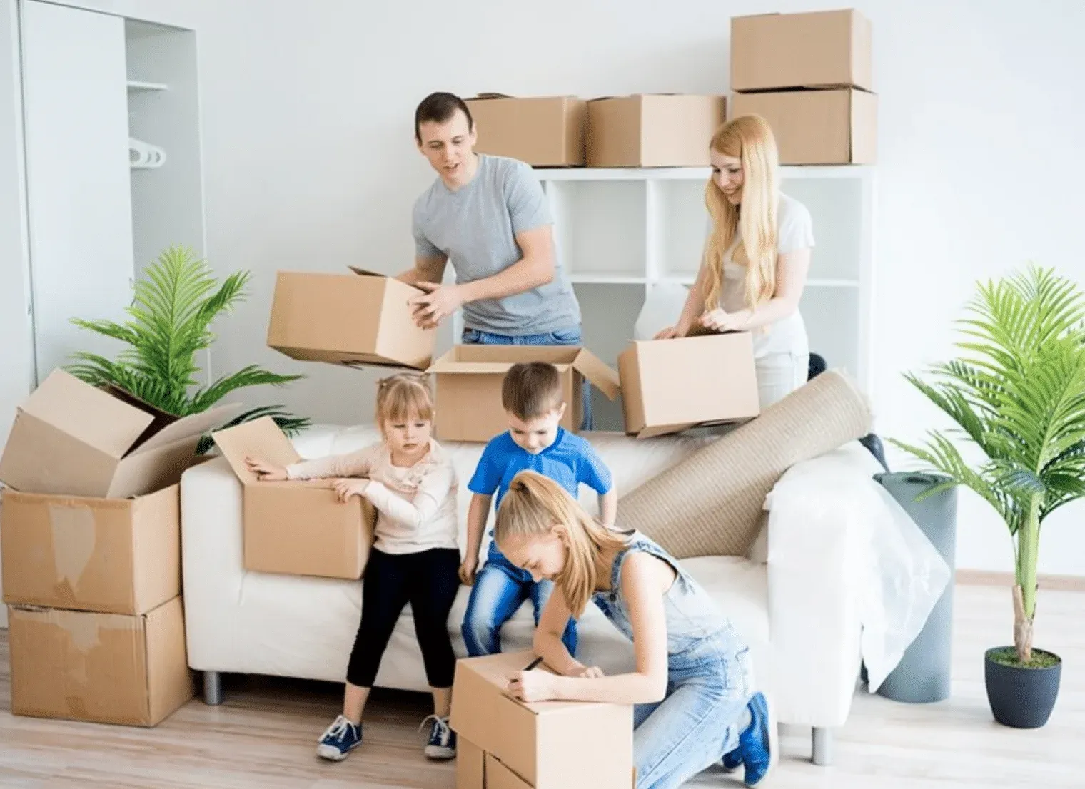 Family packing boxes for a Wollongong to Newcastle move